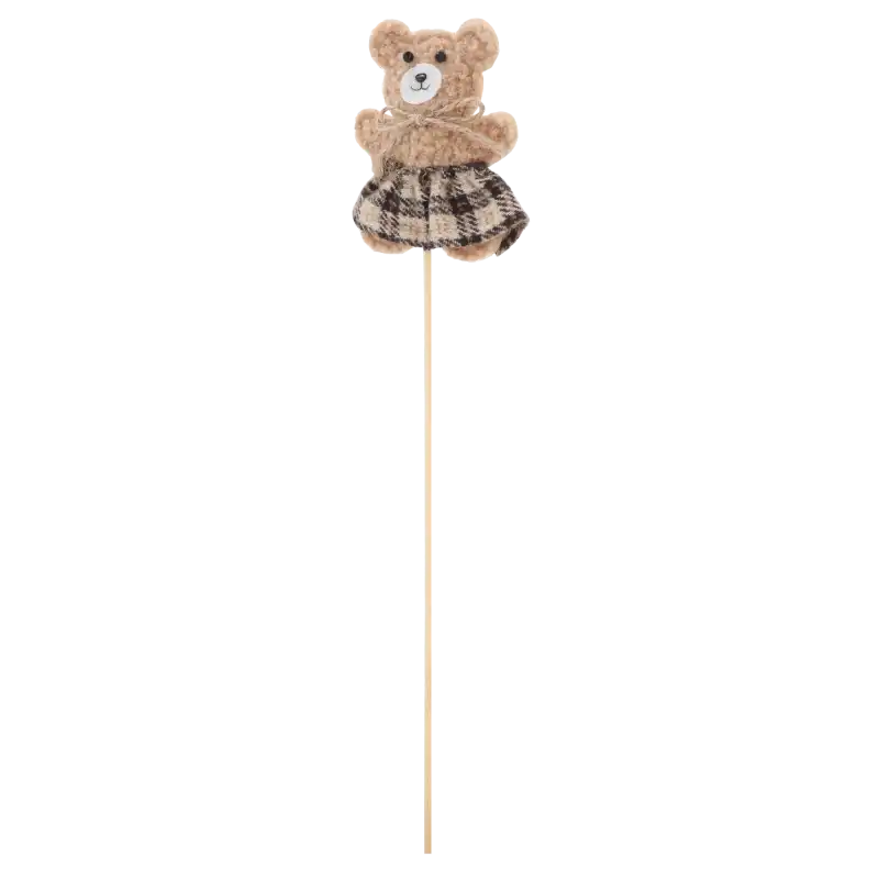 Beżowy filcowy miś w spódniczce na piku o wysokości 33 cm.