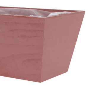 Zbliżenie na narożnik i widoczną strukturę drewna różowej drewnianej skrzynki na kwiaty 20x12x10 cm