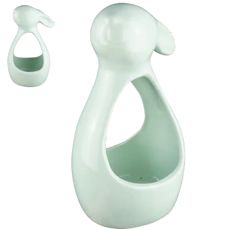 Zielony królik ceramiczny 21 cm w formie świecznika z dołączonym sznurkiem do zawieszenia. Nowoczesna dekoracja, która wprowadza wyjątkowy klimat do domu, nie tylko podczas Wielkanocy.